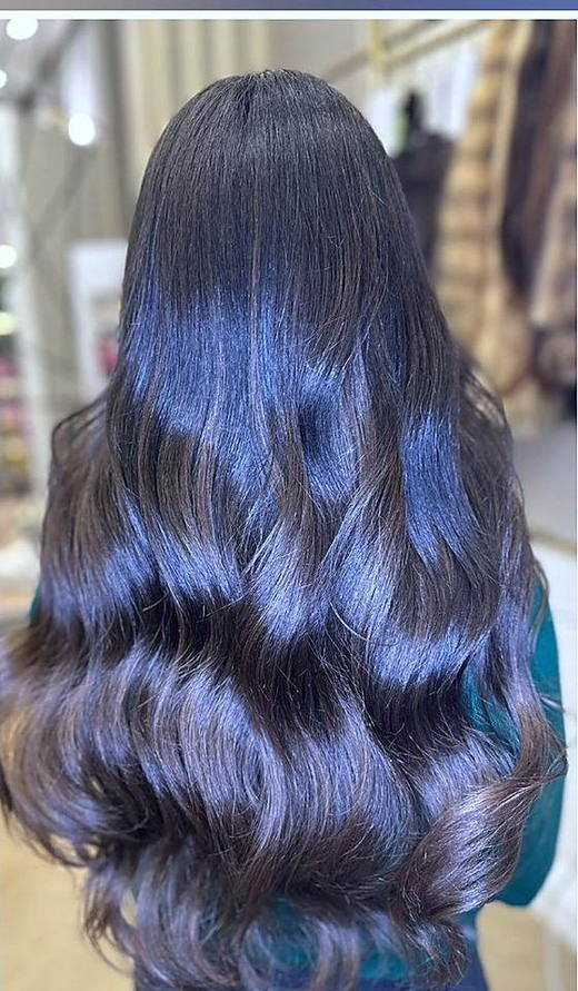 Dark, waved after extensions at PhiStudio Dubai