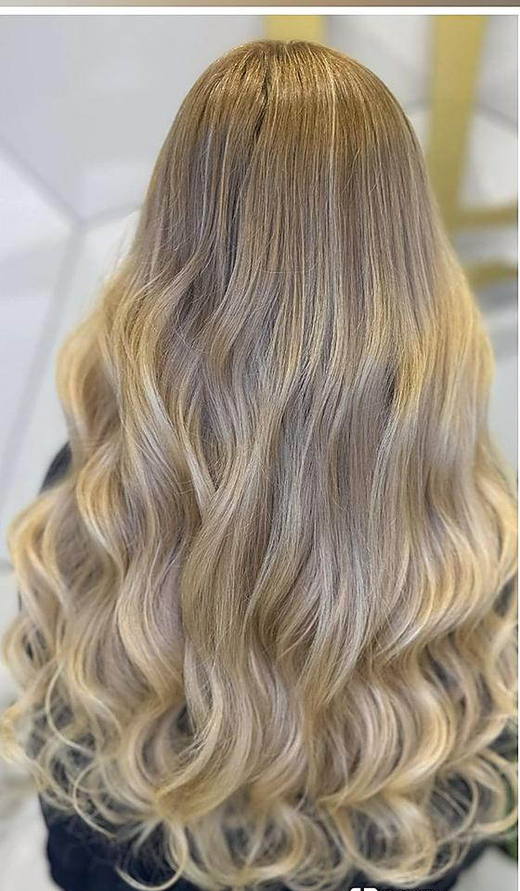 Icy blonde waves after extensions at PhiStudio Dubai