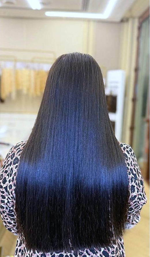 Jet black, straight after extensions at PhiStudio Dubai