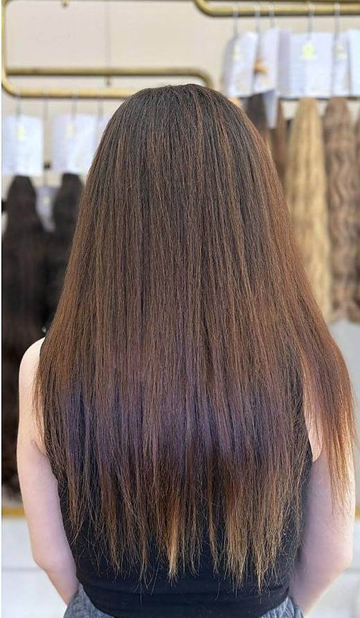 Long brown waves before extensions at PhiStudio Dubai